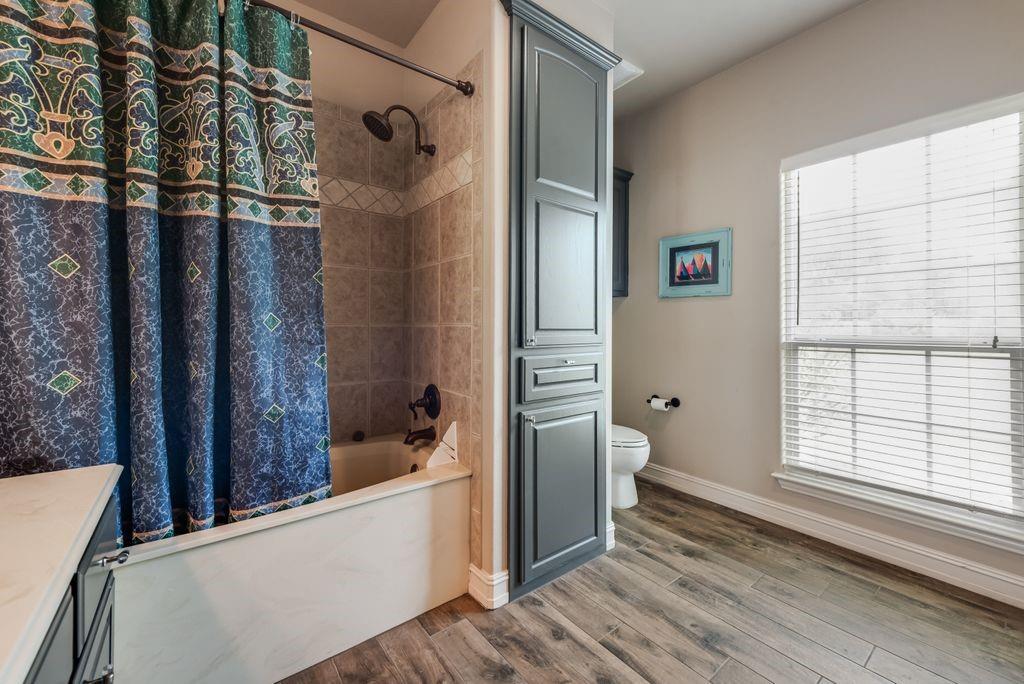 13026 Rudy's Way Streetman, TX 75859 - Photo 25 of 40 a bathroom with a bathtub and a shower