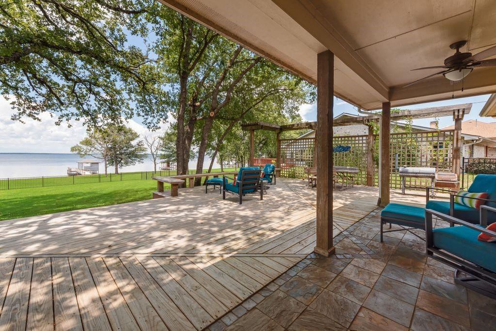 13026 Rudy's Way Streetman, TX 75859 - Photo 26 of 40 a view of a house with backyard and sitting area