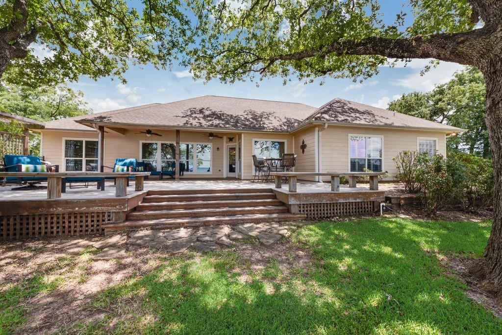13026 Rudy's Way Streetman, TX 75859 - Photo 28 of 40 a house view with a sitting space and garden