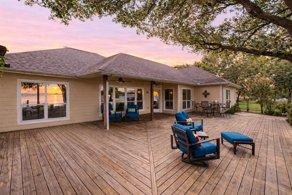 13026 Rudy's Way Streetman, TX 75859 - Photo 4 of 40 With an expansive deck shaded with mature trees...the perfect space to BBQ and entertain!