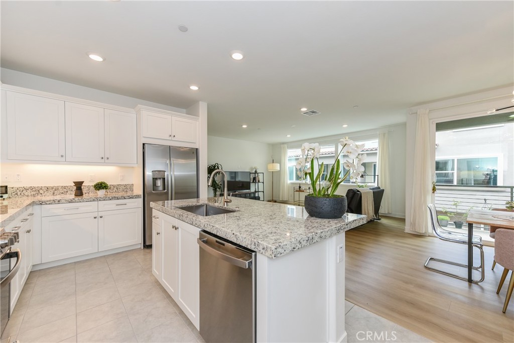 224 Siena Lake Forest, CA 92630 - Photo 11 of 46 a kitchen with stainless steel appliances granite countertop refrigerator sink and cabinets