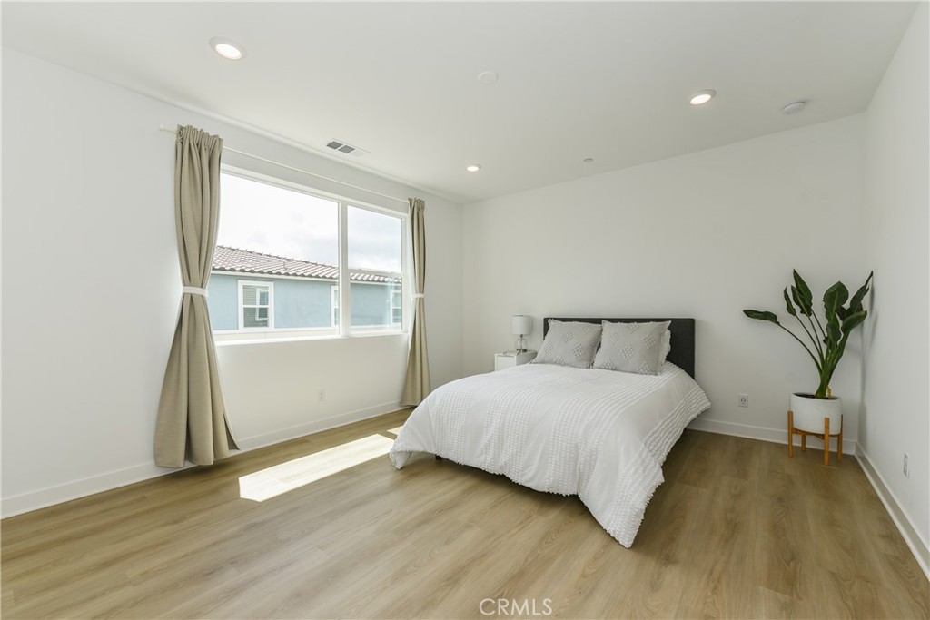 224 Siena Lake Forest, CA 92630 - Photo 22 of 46 a bedroom with a bed and window