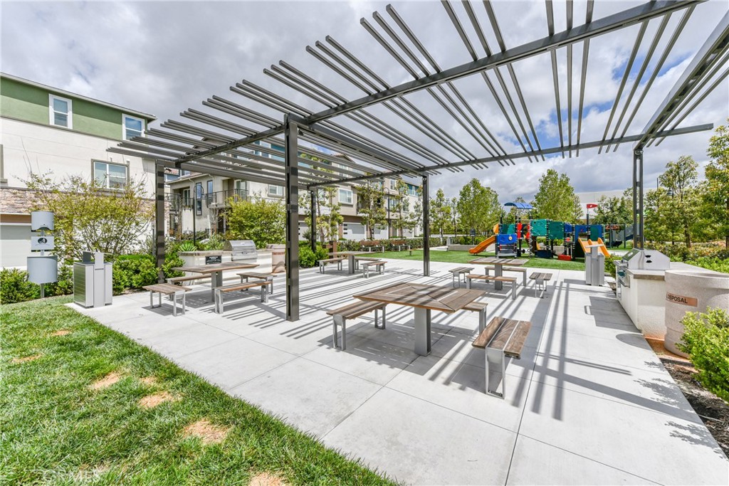 224 Siena Lake Forest, CA 92630 - Photo 31 of 46 a view of a patio with a table and chairs