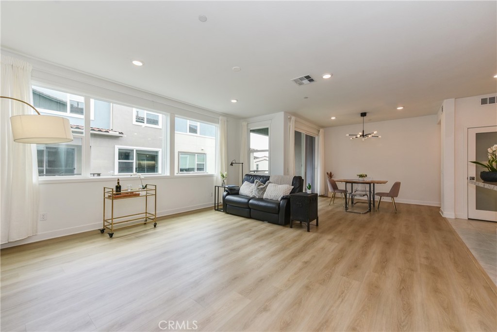 224 Siena Lake Forest, CA 92630 - Photo 6 of 46 a living room with furniture and a table