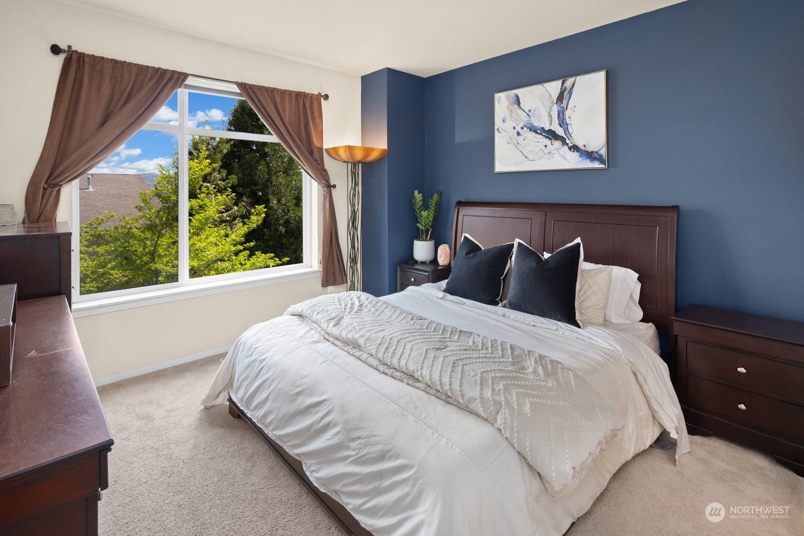 124 Sky Ridge Road Northwest Issaquah, WA 98027 - Photo 14 of 40 a bedroom with a bed and a painting on the wall