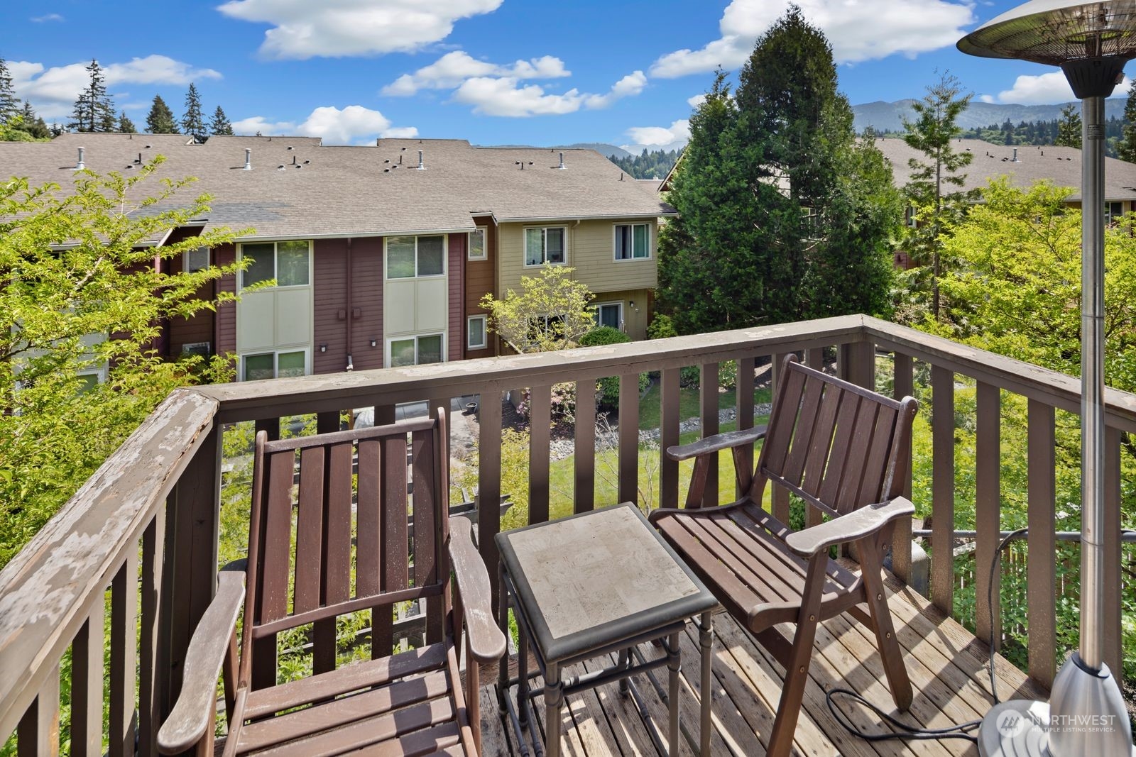 124 Sky Ridge Road Northwest Issaquah, WA 98027 - Photo 29 of 40 a view of a patio with a table and chairs
