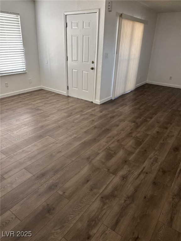 2377 Exeter Drive, Unit 3 Las Vegas, NV 89156 - Photo 12 of 13 Empty room with dark wood-type flooring and baseboards