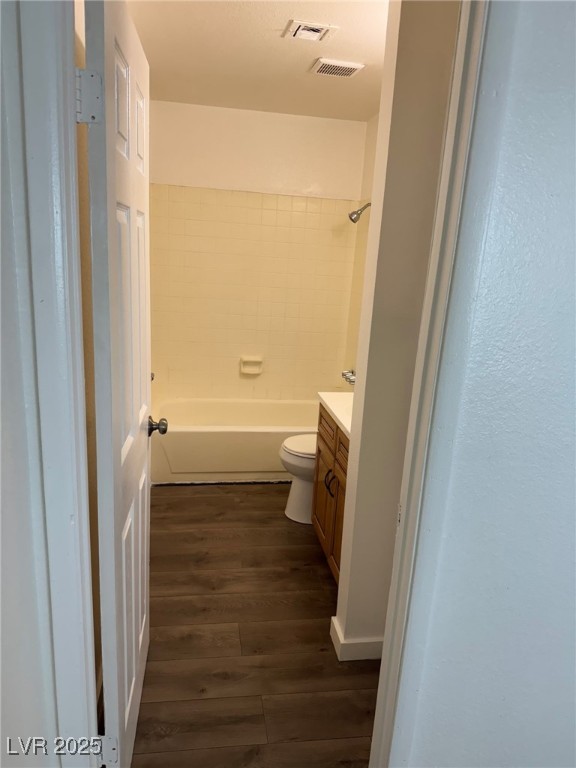 2377 Exeter Drive, Unit 3 Las Vegas, NV 89156 - Photo 3 of 13 Full bathroom with vanity, wood finished floors, and shower combination