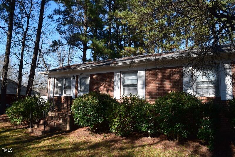 2915 Ross Road Durham, NC 27703 - Photo 18 of 21 a view of house with a tree in front of it