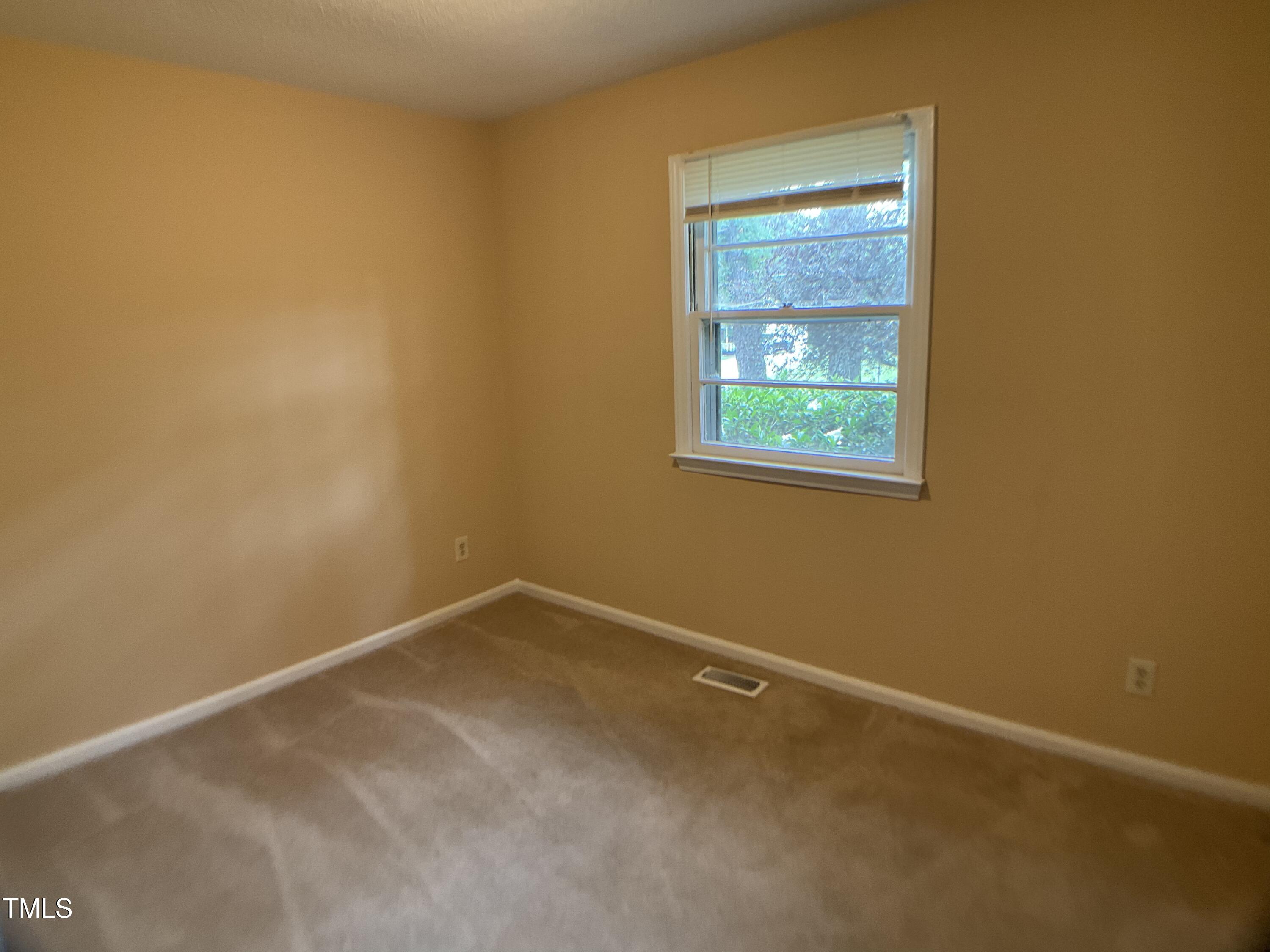 2915 Ross Road Durham, NC 27703 - Photo 8 of 21 an empty room with a window