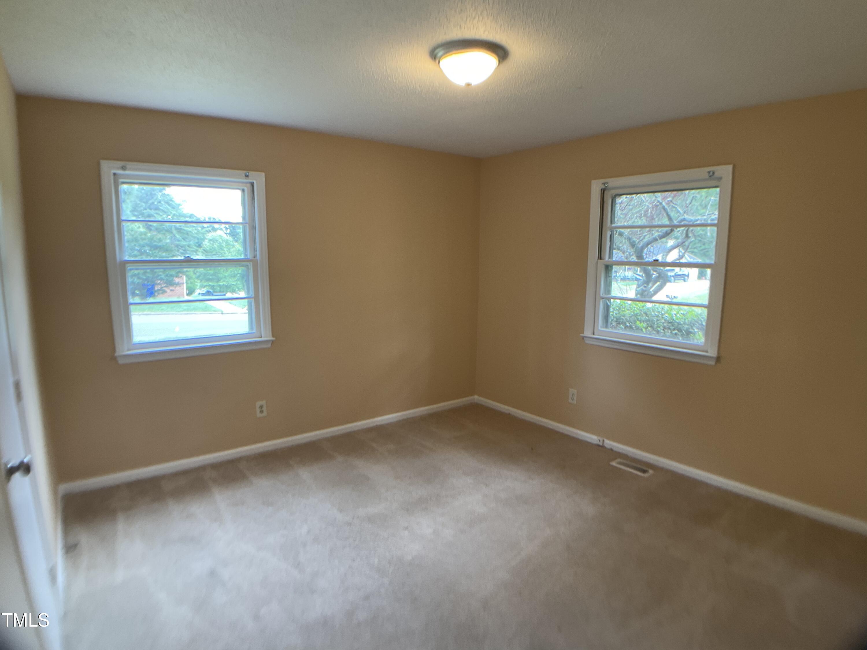 2915 Ross Road Durham, NC 27703 - Photo 10 of 21 an empty room with windows