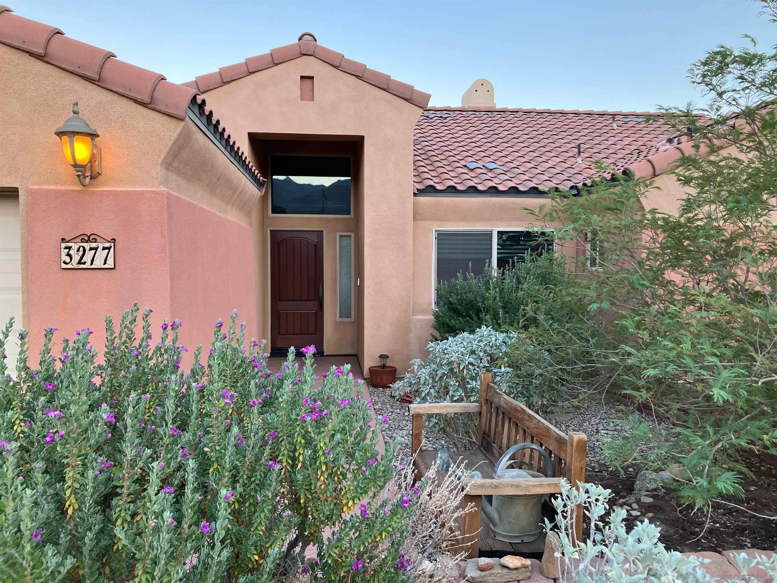 3277 Frying Pan Road Borrego Springs, CA 92004 - Photo 2 of 43 a front view of a house with a yard and garage