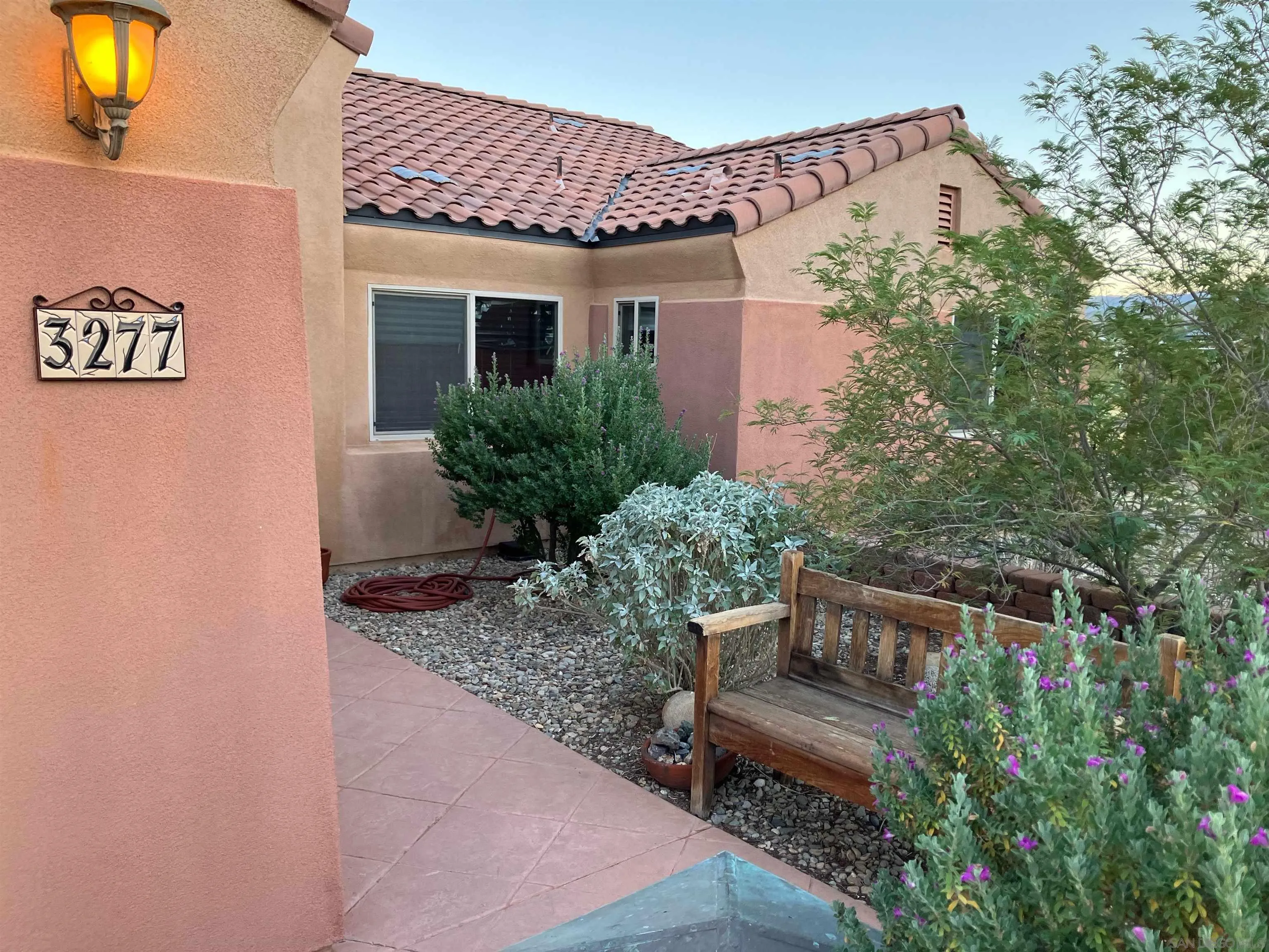 3277 Frying Pan Road Borrego Springs, CA 92004 - Photo 3 of 43 a front view of a house with garden