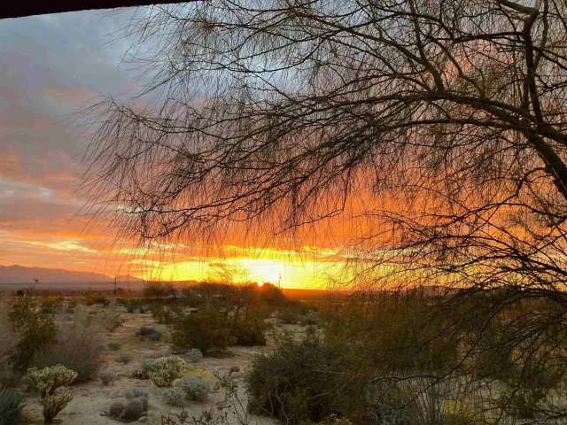 a view of a road with a building in the background