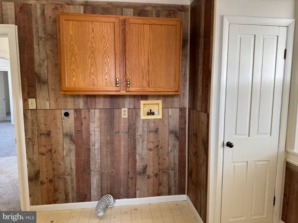 an empty room with a fan