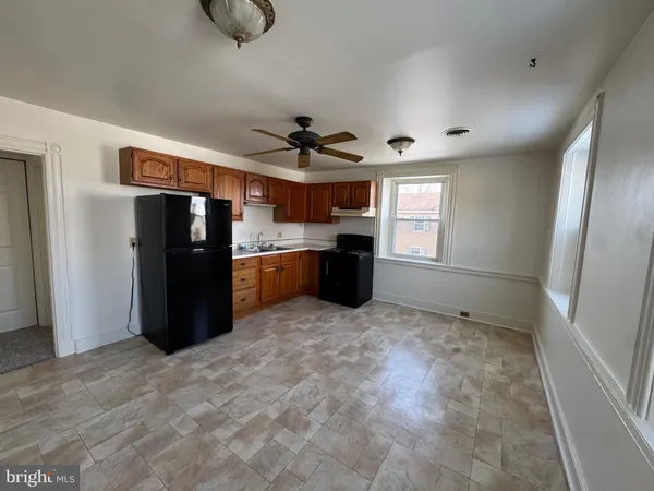 a view of kitchen with window and stainless steel appliances