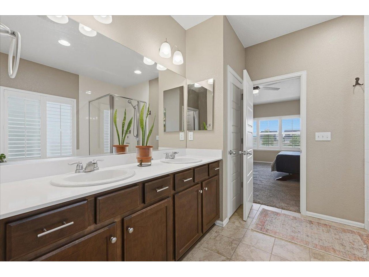 6096 Story Road Timnath, CO 80547 - Photo 24 of 50 a bathroom with a sink vanity and a mirror