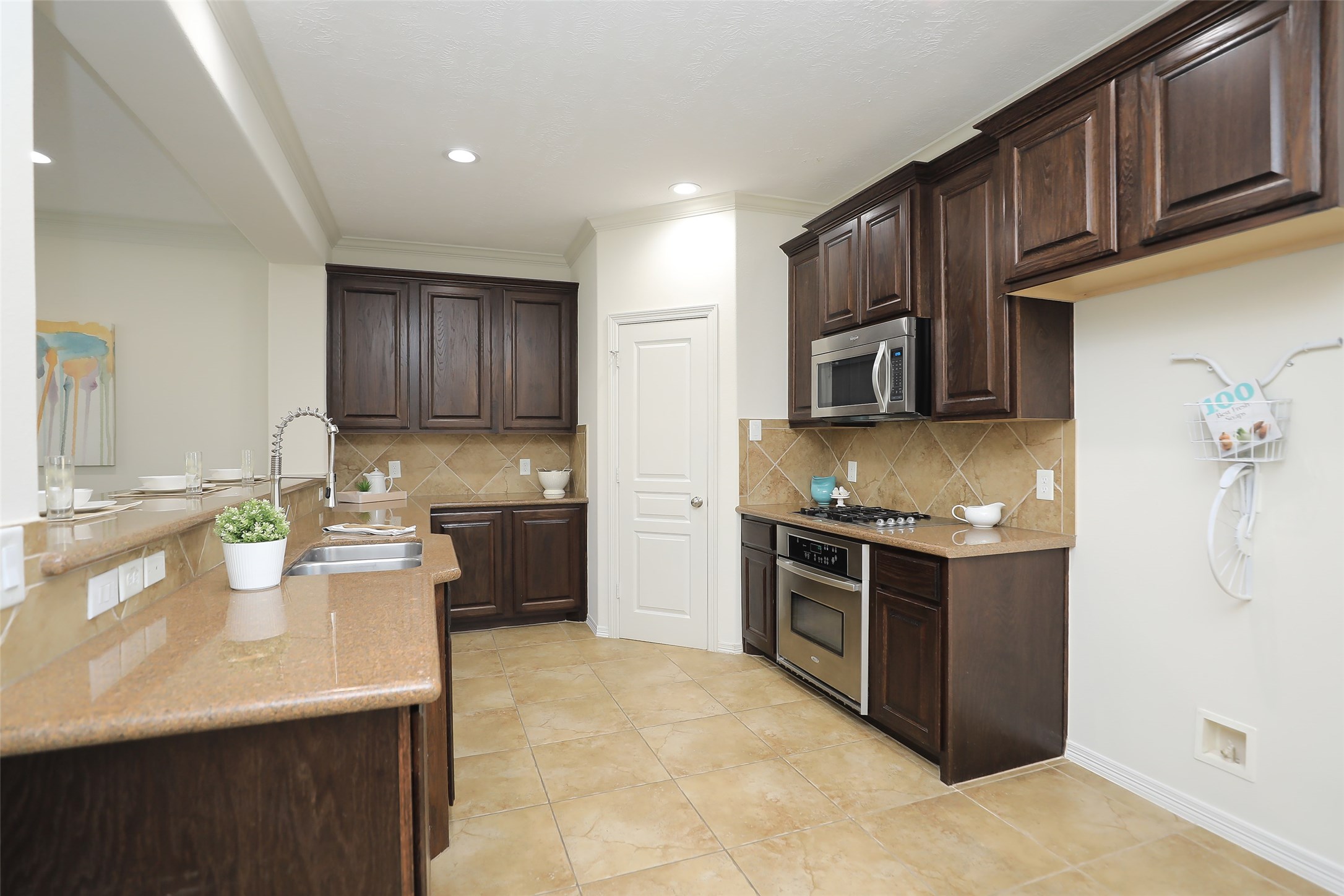 1311 Bingham Street, Unit B Houston, TX 77007 - Photo 15 of 29 a kitchen with stainless steel appliances granite countertop a sink stove and refrigerator