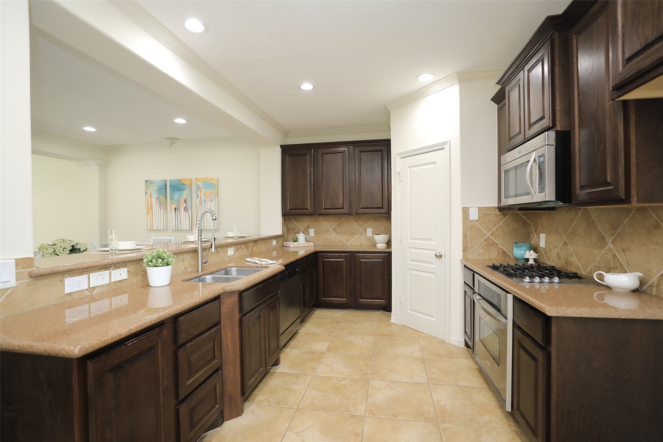 1311 Bingham Street, Unit B Houston, TX 77007 - Photo 16 of 29 a kitchen with stainless steel appliances granite countertop a stove a sink dishwasher and a refrigerator