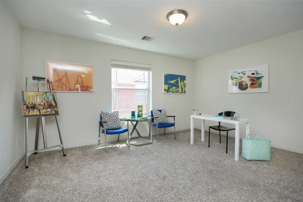 a kitchen with a table and chairs in it