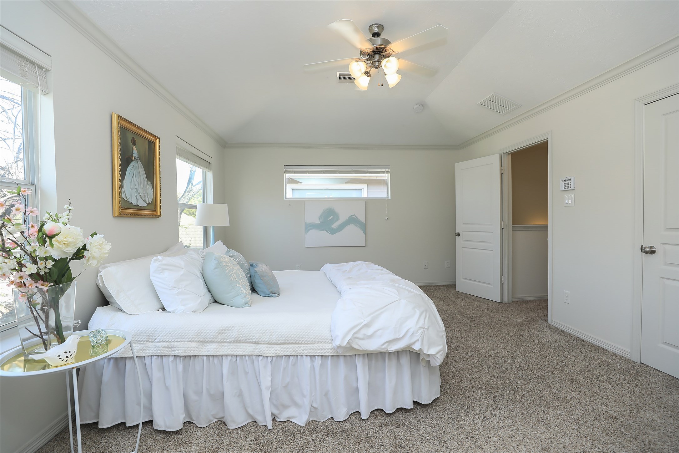 1311 Bingham Street, Unit B Houston, TX 77007 - Photo 21 of 29 a bedroom with a bed and a chandelier