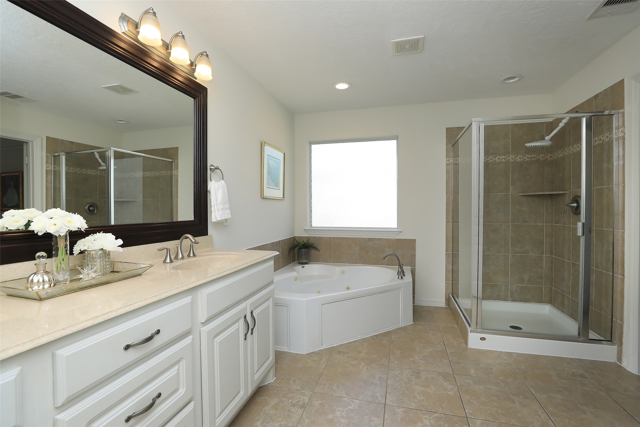 1311 Bingham Street, Unit B Houston, TX 77007 - Photo 24 of 29 a spacious bathroom with a double vanity sink mirror and shower