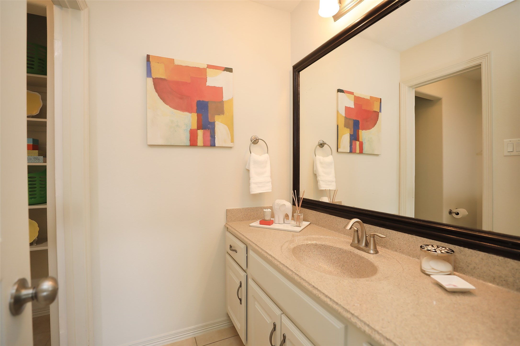1311 Bingham Street, Unit B Houston, TX 77007 - Photo 27 of 29 a bathroom with a granite countertop sink mirror and vanity