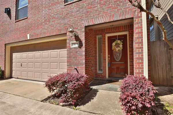 a front view of a house with a garage