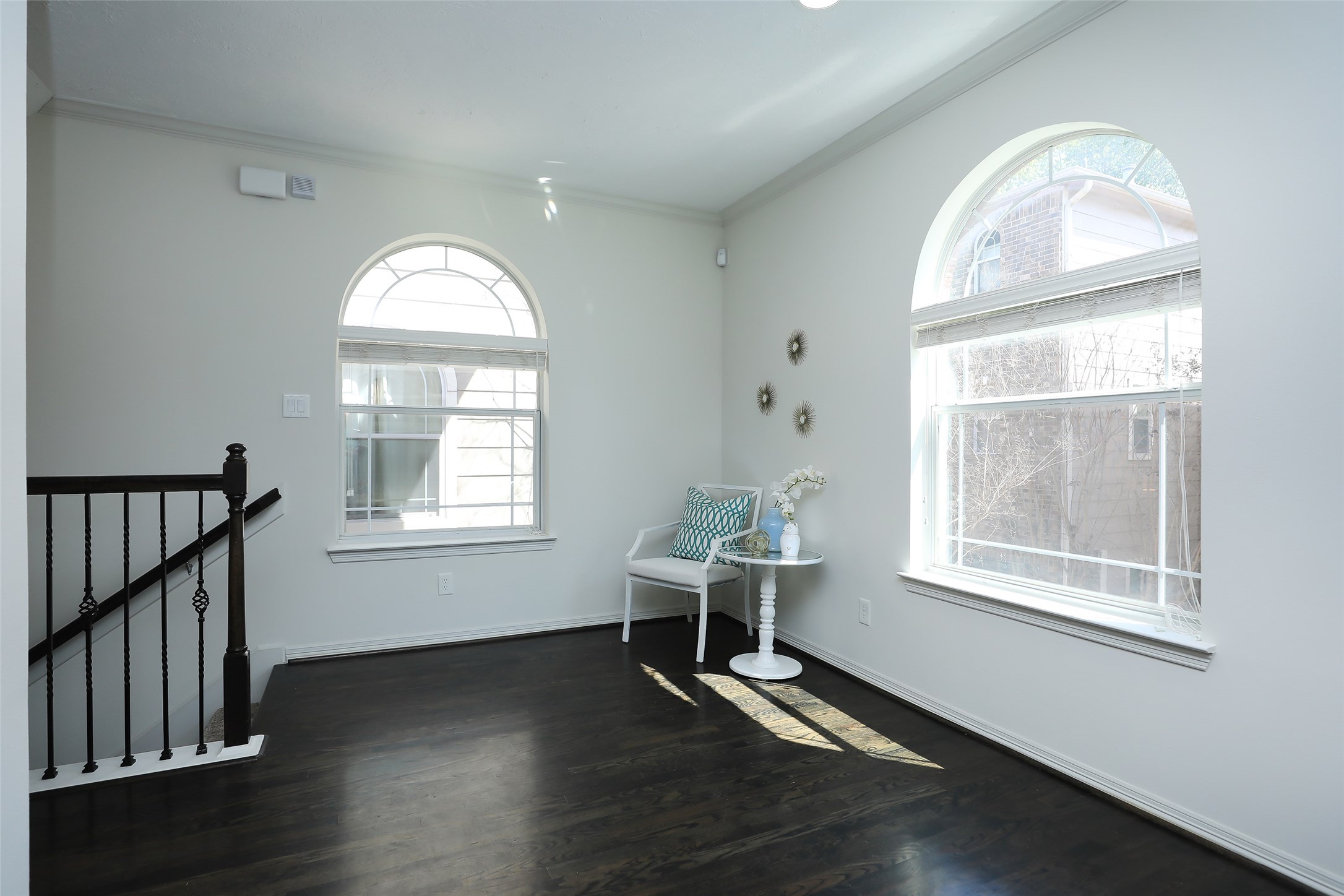 1311 Bingham Street, Unit B Houston, TX 77007 - Photo 7 of 29 an empty room with wooden floor windows and wooden floor