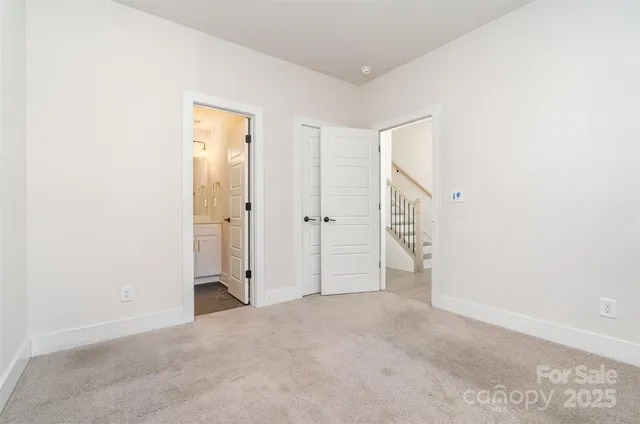 an empty room with closet area