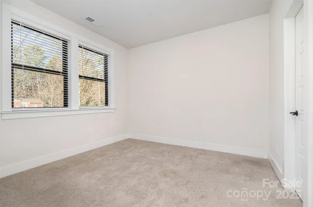 a bathroom with a shower sink and mirror