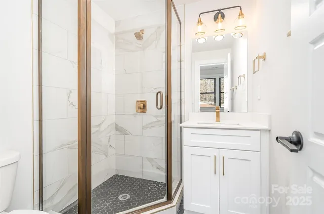 a view of a brick house with large windows