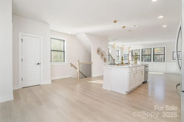 a view of kitchen with white cabinets