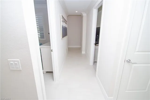 a view of a bathroom from a hallway