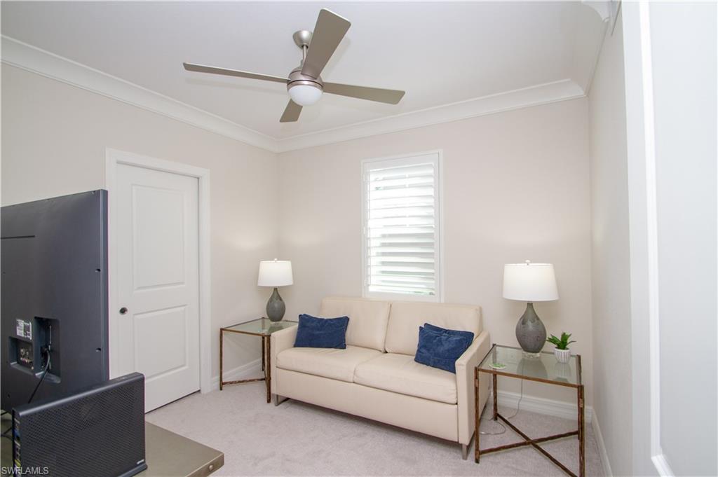 232 Indies Drive East, Unit 101 Naples, FL 34114 - Photo 30 of 50 a living room with furniture and a window