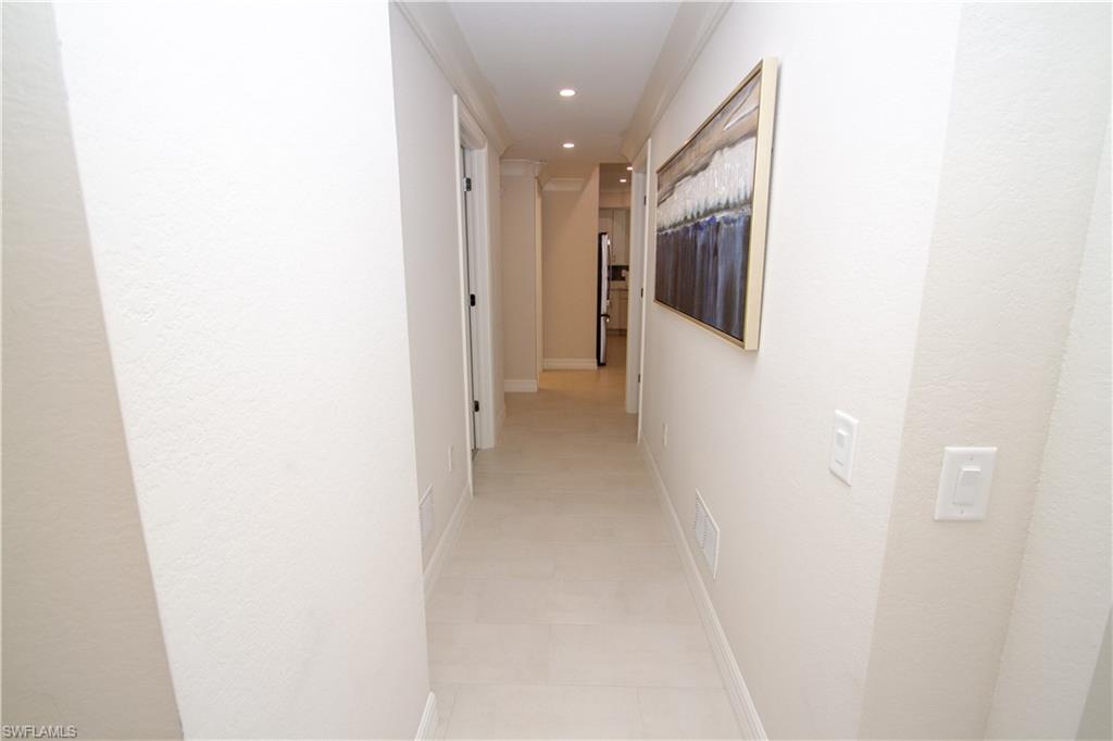 232 Indies Drive East, Unit 101 Naples, FL 34114 - Photo 33 of 50 a view of a hallway