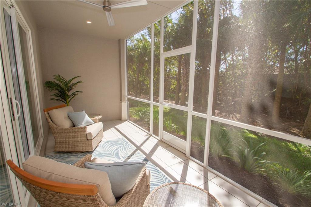 232 Indies Drive East, Unit 101 Naples, FL 34114 - Photo 37 of 50 a balcony with furniture and potted plants