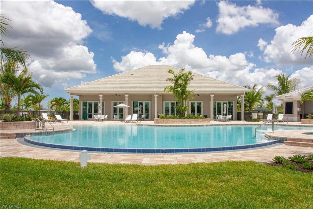232 Indies Drive East, Unit 101 Naples, FL 34114 - Photo 42 of 50 a view of a house with a swimming pool