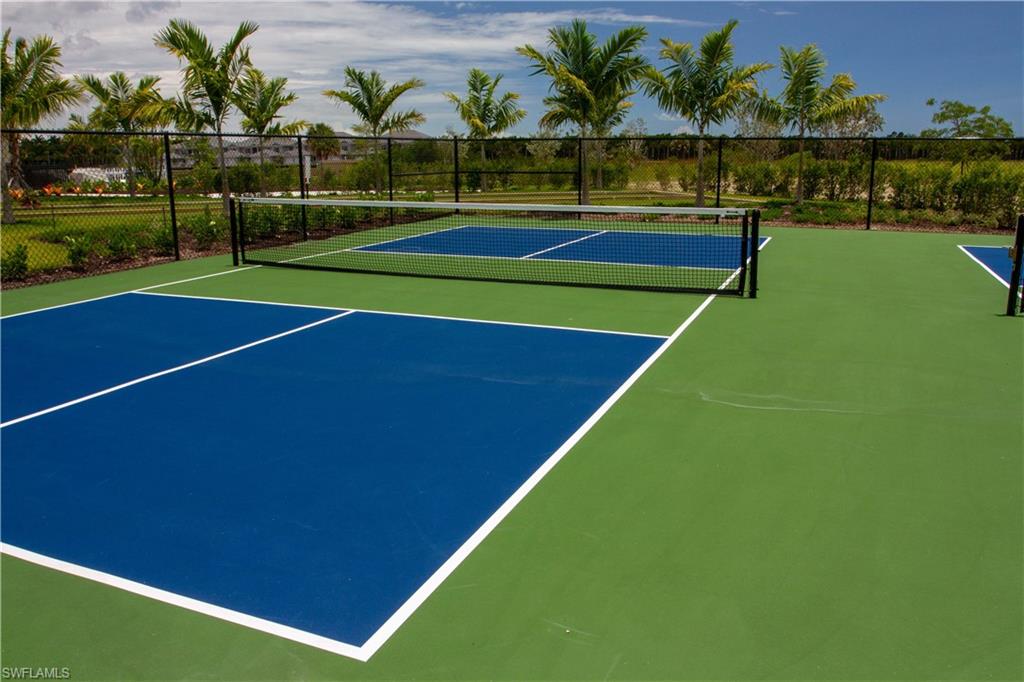 232 Indies Drive East, Unit 101 Naples, FL 34114 - Photo 47 of 50 a view of an outdoor space and swimming pool