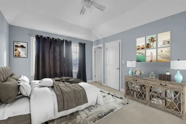 a bedroom with double bed and a window