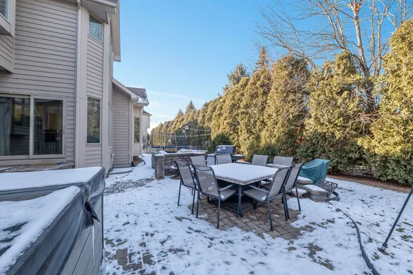a view of a dinning table and chairs in the patio