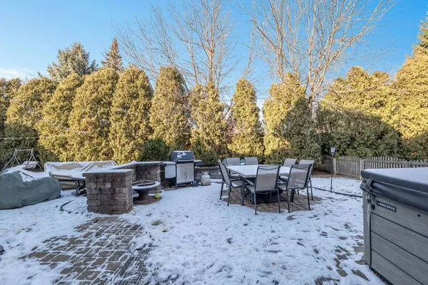 a backyard of a house with outdoor seating