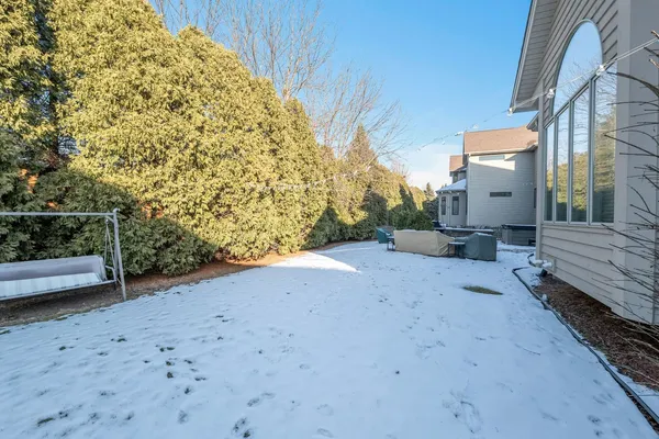 a view of a backyard of the house