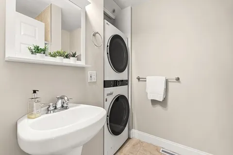 a bathroom with a sink a mirror and a toilet