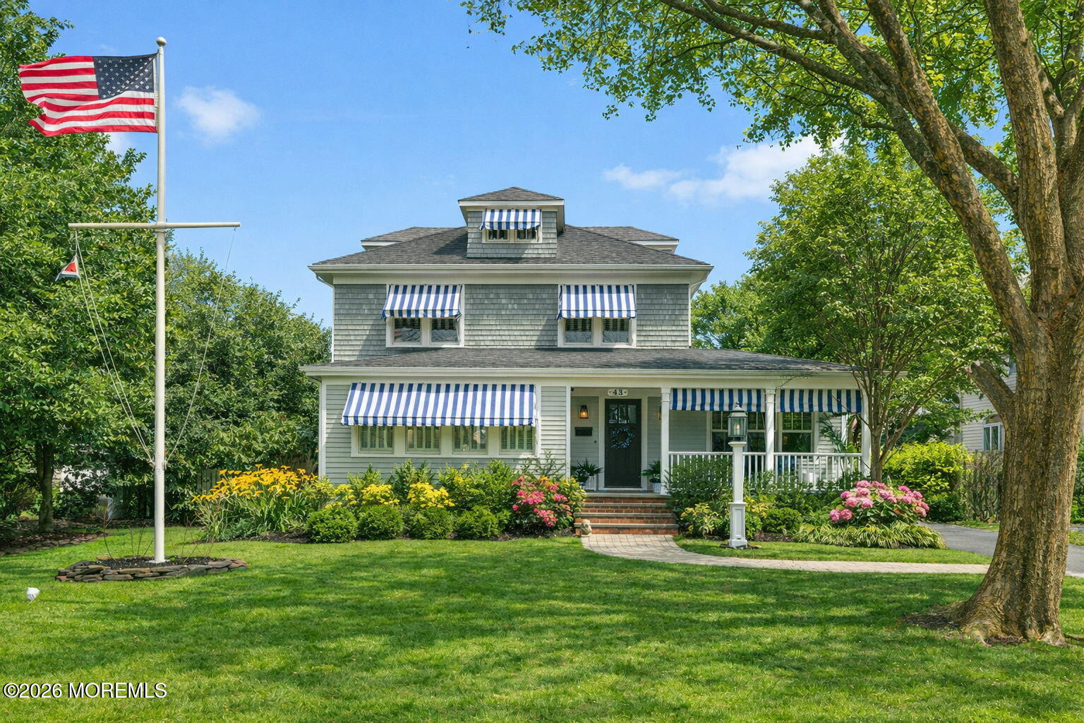 43 Bingham Avenue Rumson, NJ 07760 - Photo 1 of 59 a front view of a house with a garden
