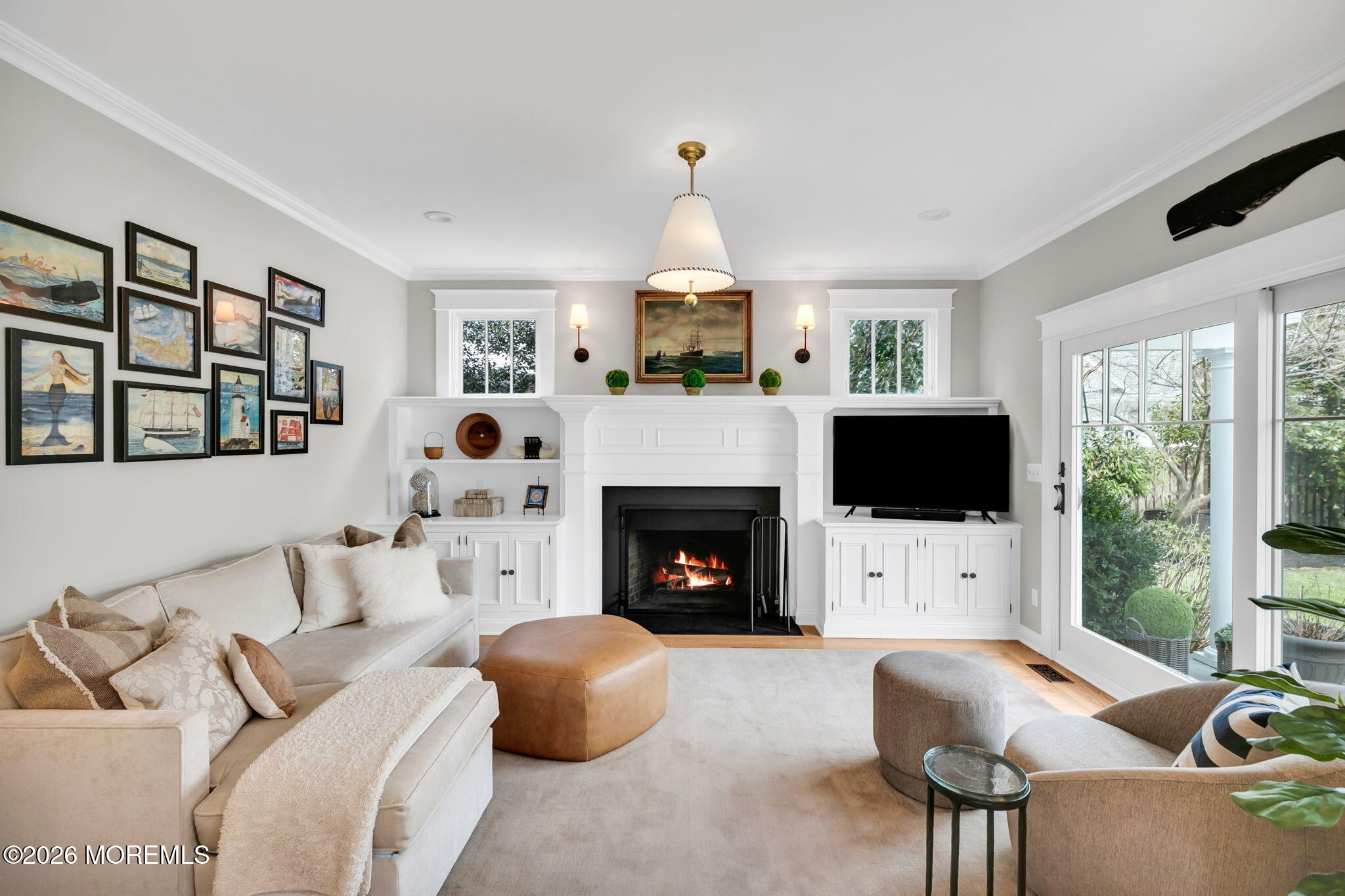 43 Bingham Avenue Rumson, NJ 07760 - Photo 21 of 59 a living room with furniture a fireplace and a flat screen tv