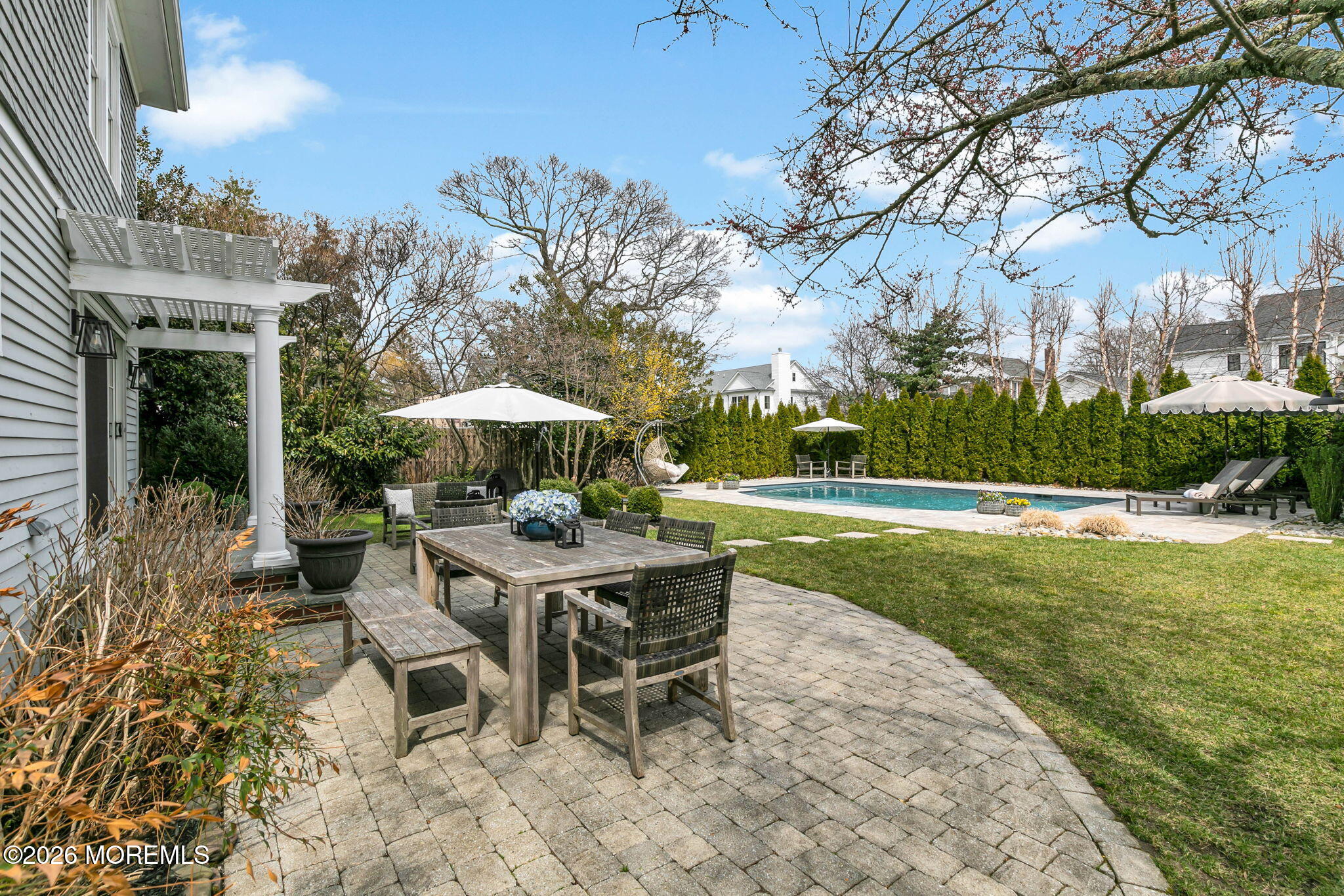 43 Bingham Avenue Rumson, NJ 07760 - Photo 24 of 59 a view of a house with a yard chairs and table in the patio