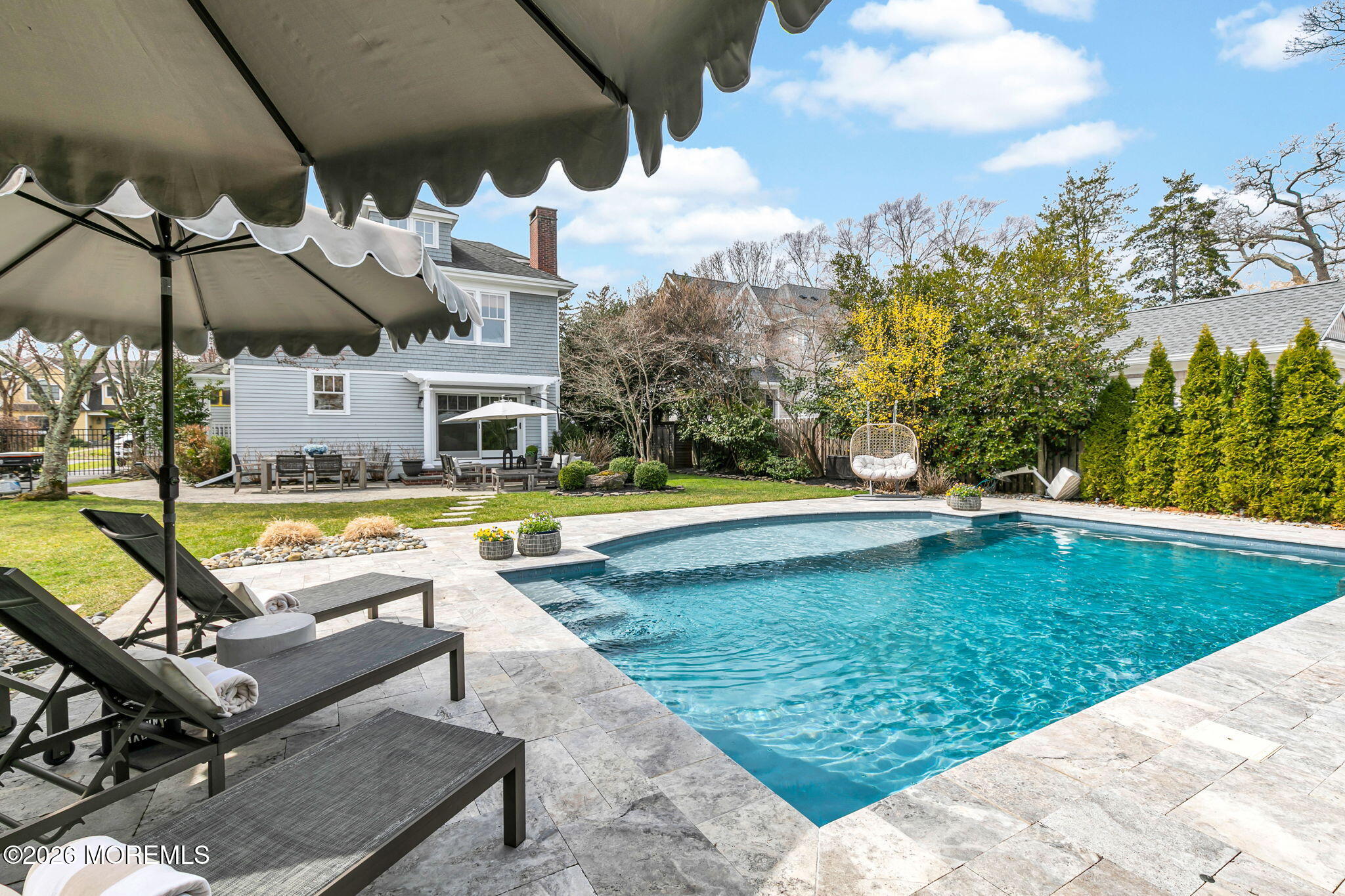 43 Bingham Avenue Rumson, NJ 07760 - Photo 33 of 59 a view of a swimming pool and lounge chairs