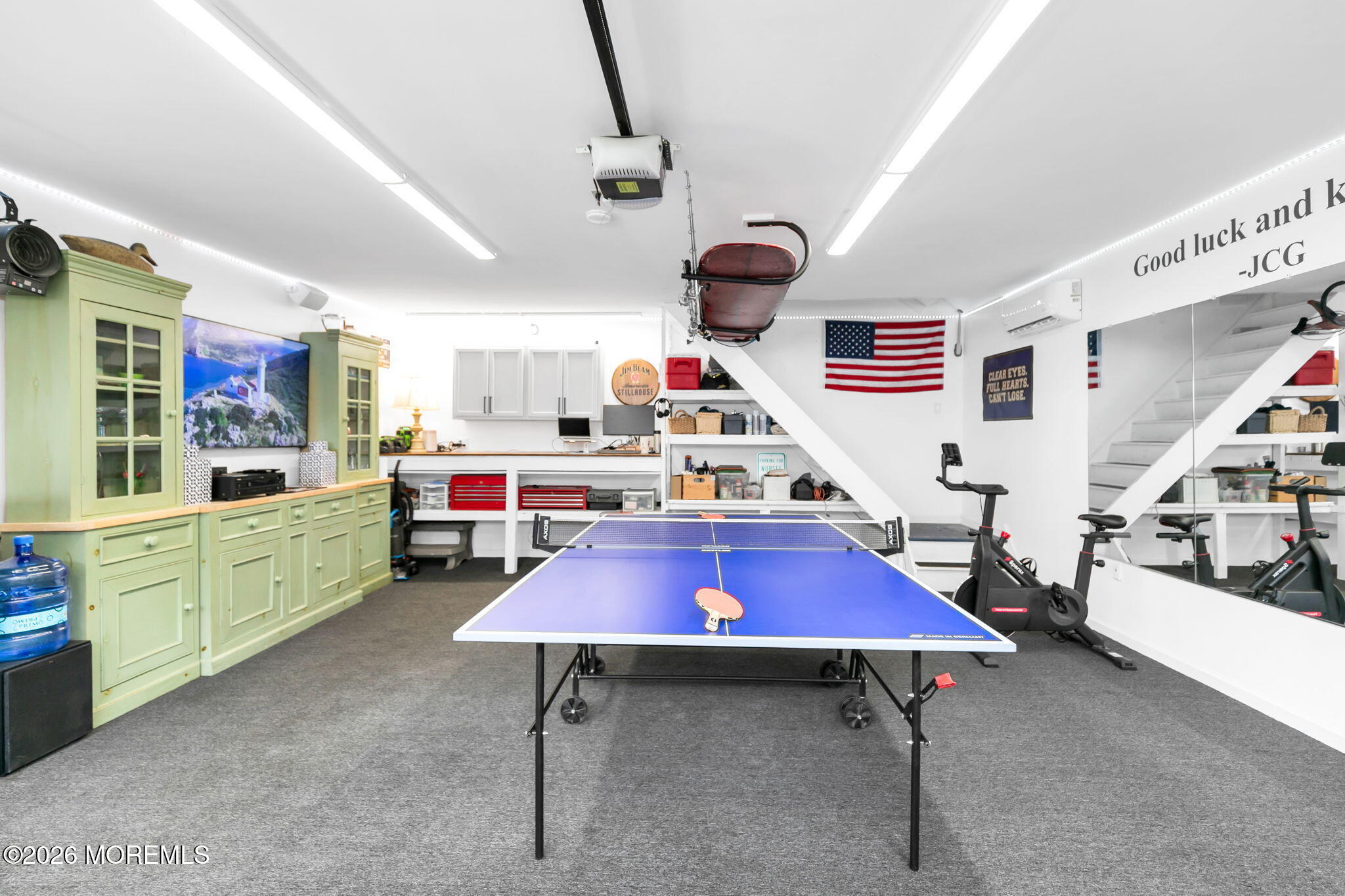 43 Bingham Avenue Rumson, NJ 07760 - Photo 37 of 59 a kitchen with stainless steel appliances kitchen island granite countertop a table chairs and a refrigerator