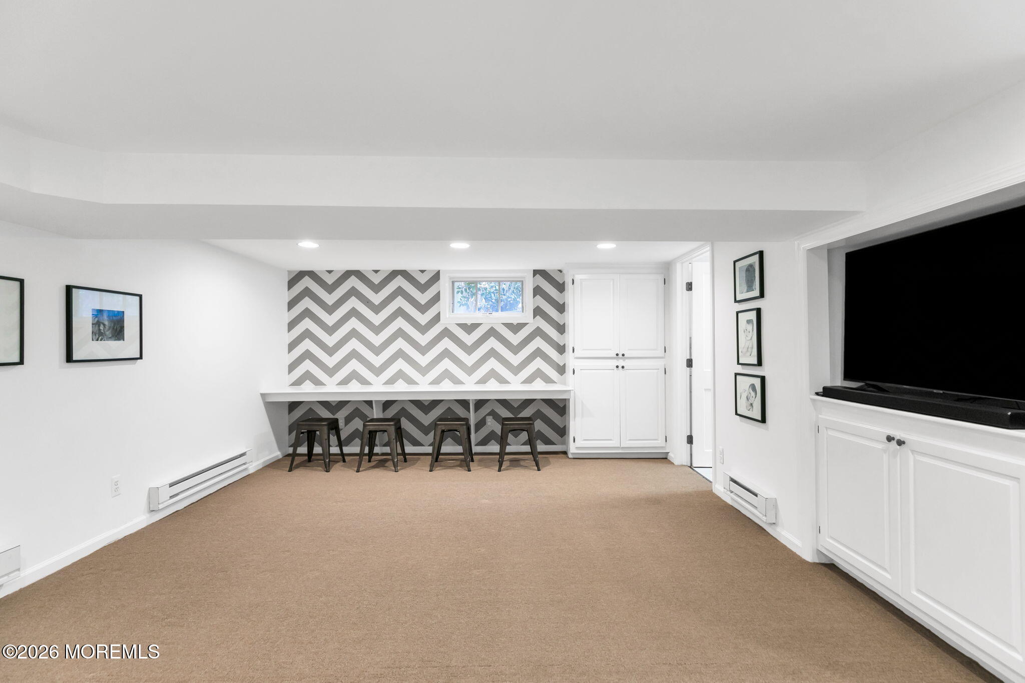 43 Bingham Avenue Rumson, NJ 07760 - Photo 39 of 59 a living room with furniture and a flat screen tv
